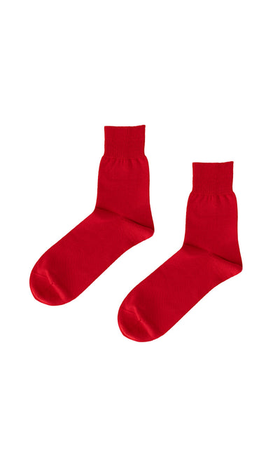Plümo- A pair of Japanese Red Socks displayed on a white background.