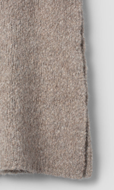 Plümo  Close-up of a taupe Borwick Tunic featuring a vertical side seam.