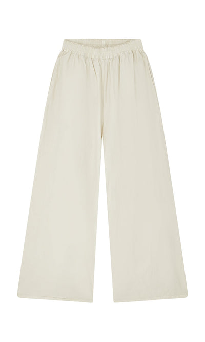 Plümo- Jung Pants: Wide-leg, high-waisted cotton pants with an elastic waistband, shown flat on a white background.