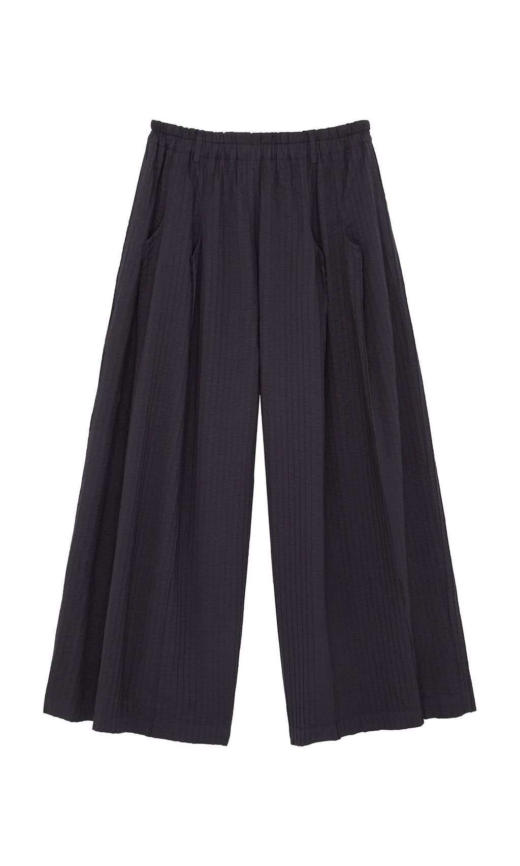 Plümo- Kiri Pintuck Pants: Black wide-leg pants with vertical pleats and an elastic waistband, inspired by Japanese style.