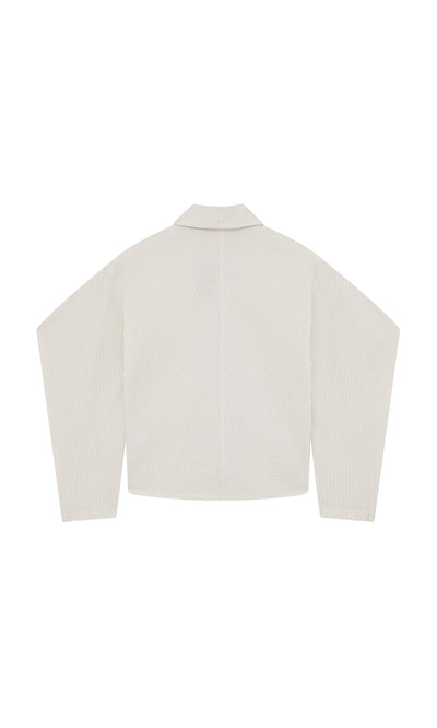 Plümo- Back view of the Ting Blouse, a Japanese shirt jacket with long bishop sleeves, collar, and straight hem.