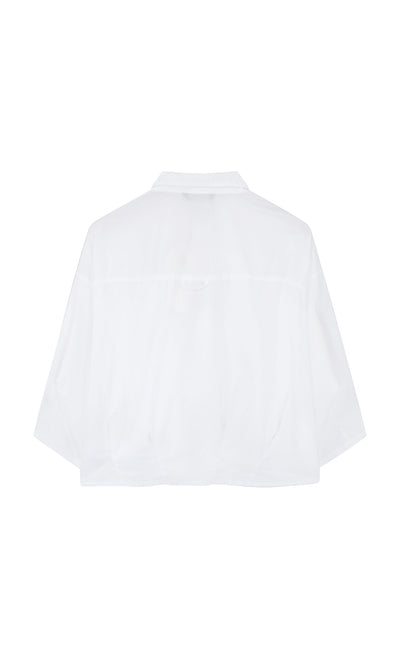 Plümo- Back view of the Fuji Shirt—a white, loose-fit, pleated top with Japanese design and a slightly cropped hem.