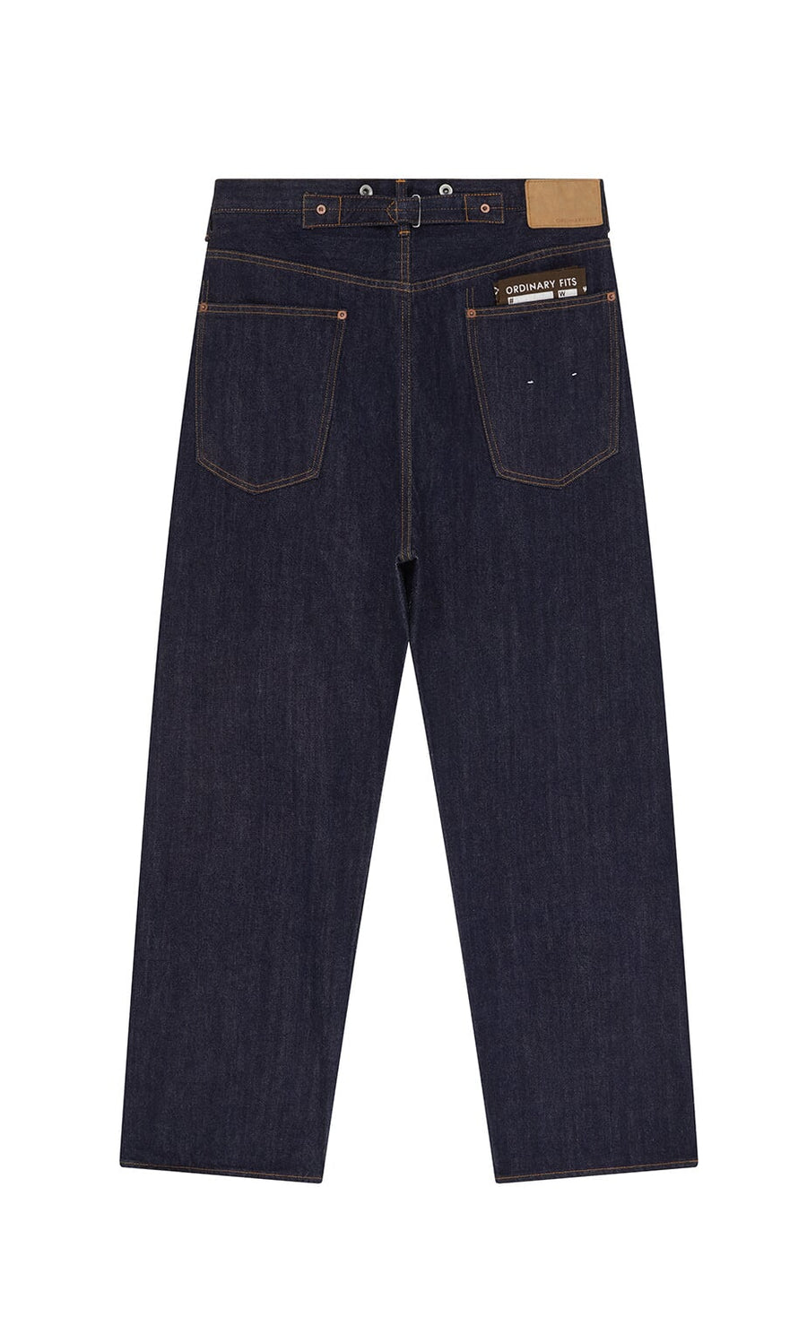 Plümo- Japanese Raw Denim Jeans in dark blue, shown from the back with two large pockets and a brown waistband patch.