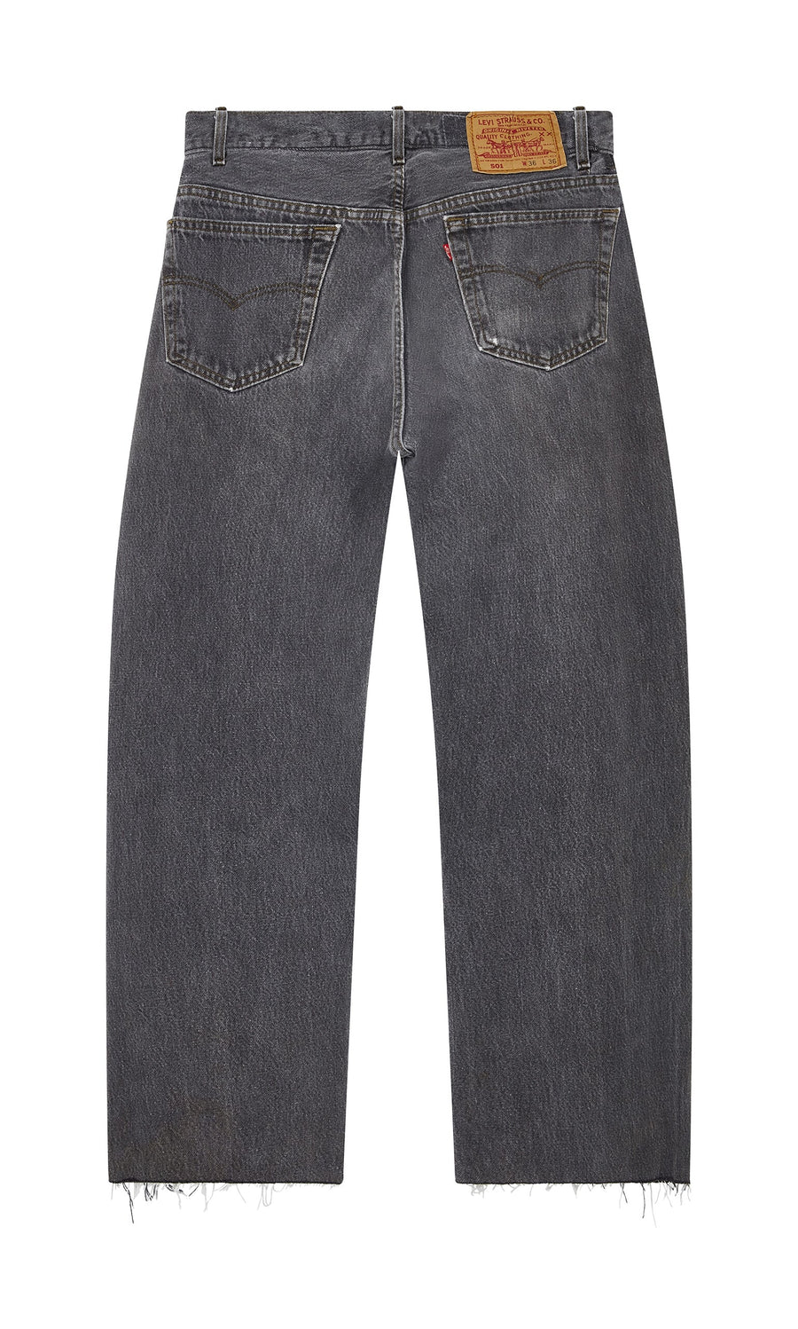Plümo- Back view of Lasso Jeans - Vintage Black with frayed hems, two pockets, and a brown leather waistband patch.