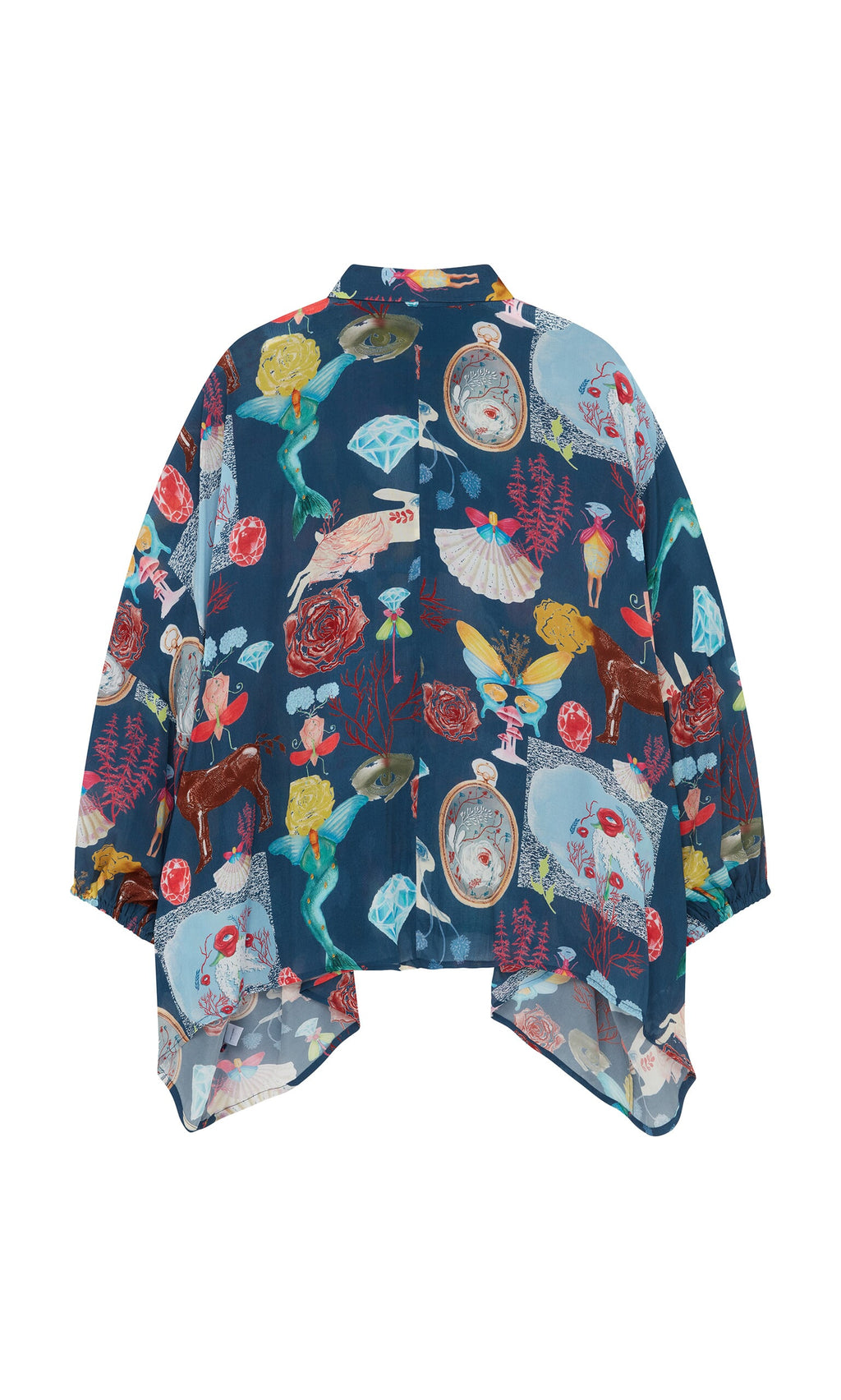 Plümo- Sketch Blouse: a blue surrealist shirt with colorful prints and an oversized fit.