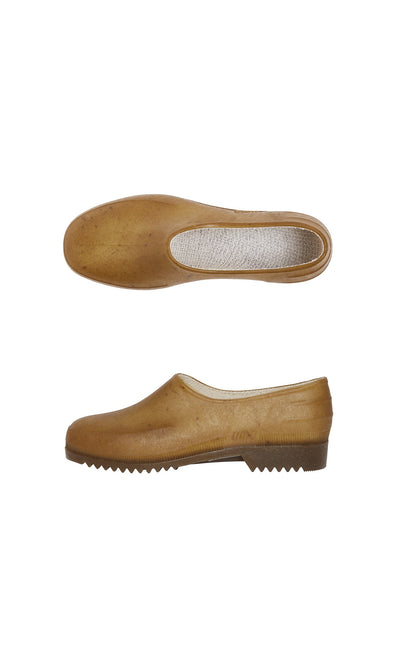 Plümo- Hemp Clogs slip-ons in brown, made from recycled plastics, shown top and side, with textured sole and simple design.