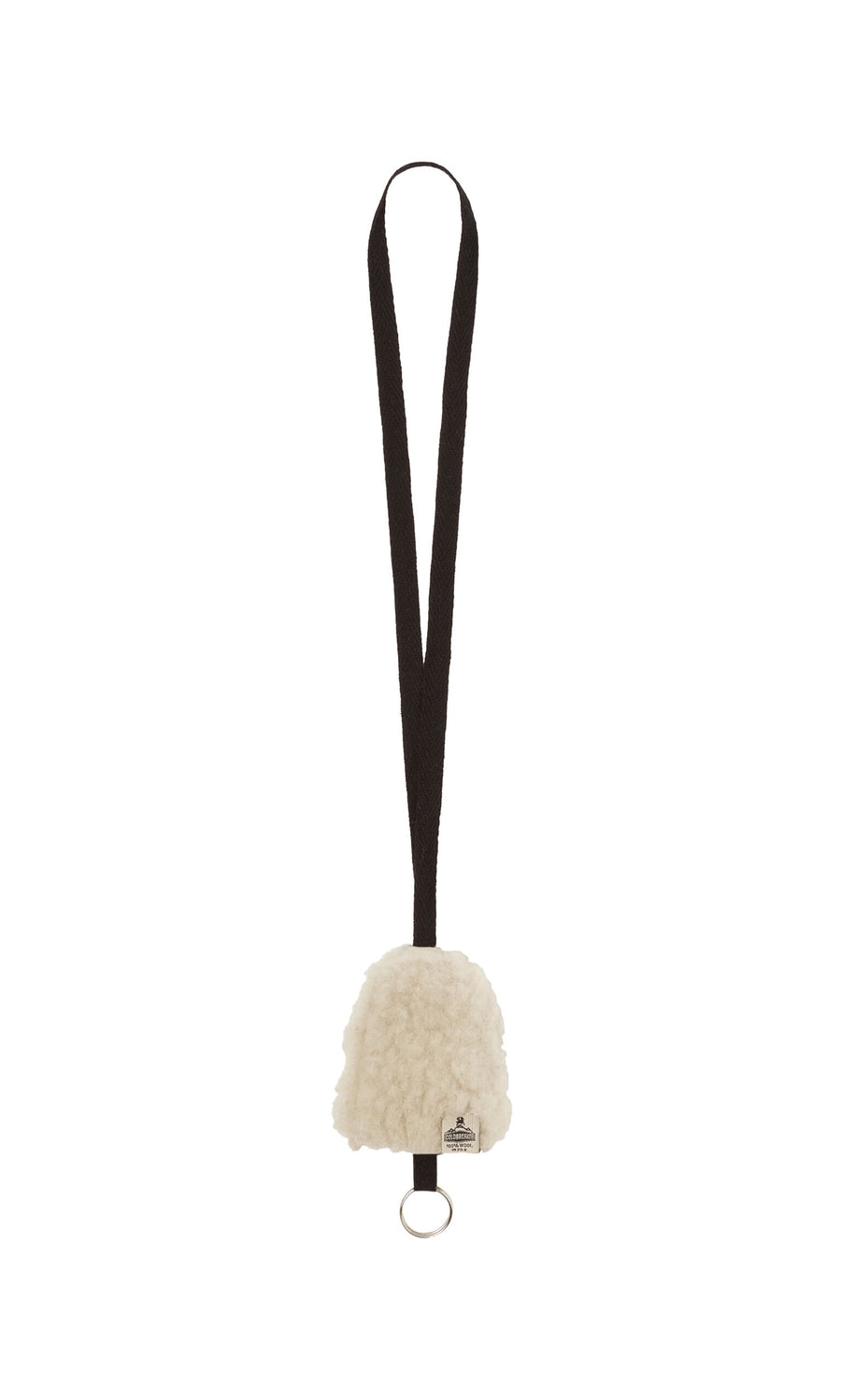 Plümo- The Shearling Keyholder is a black lanyard with a fluffy white wool pouch and metal keyring at the bottom.