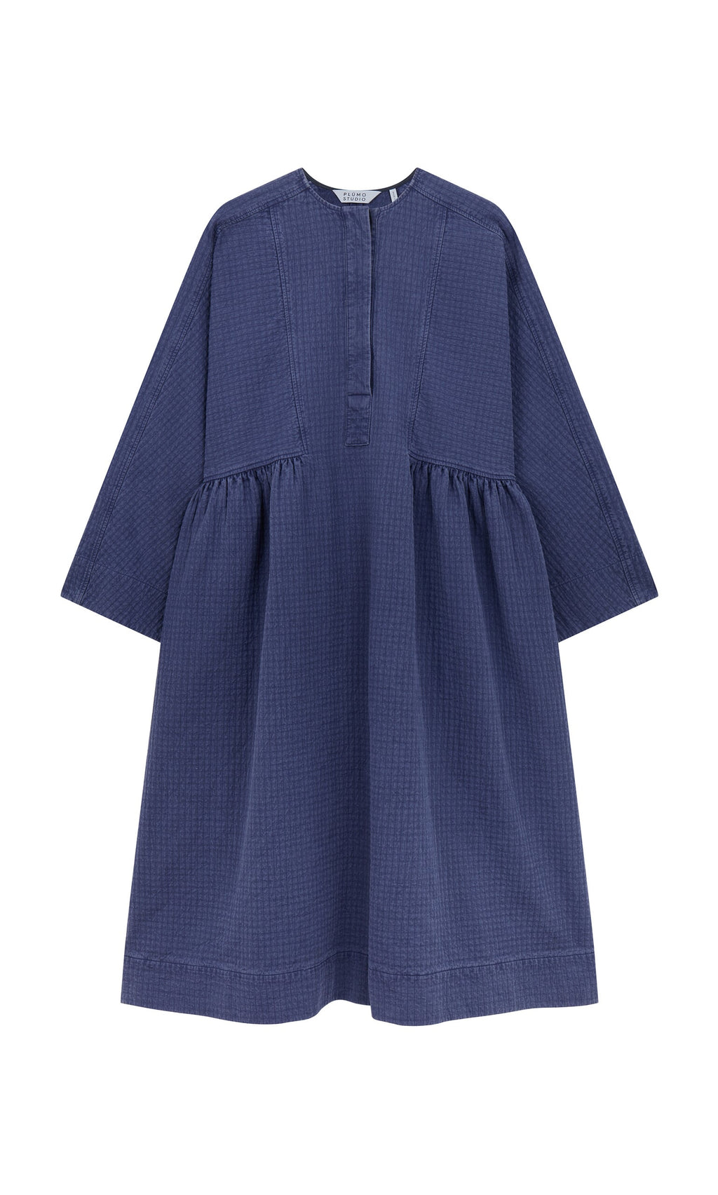 Plümo- The Matilda Dress is a loose-fit, long-sleeve bold dress with a gathered waist and short button placket. Made in London.