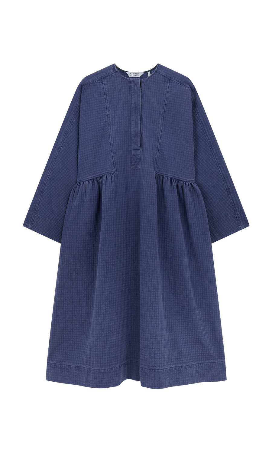 Plümo- The Matilda Dress is a loose-fit, long-sleeve bold dress with a gathered waist and short button placket. Made in London.