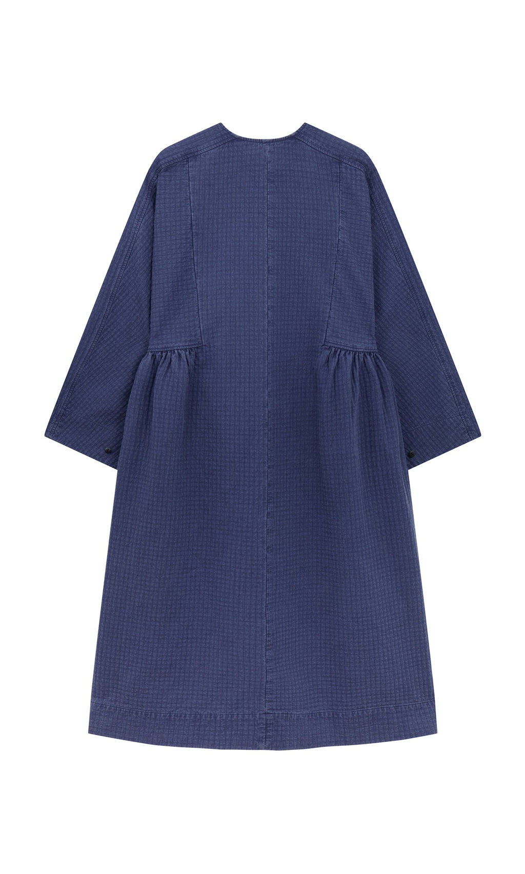 Plümo- Back view of the Matilda Dress featuring a full skirt, long sleeves, and gathered sides, made in London.