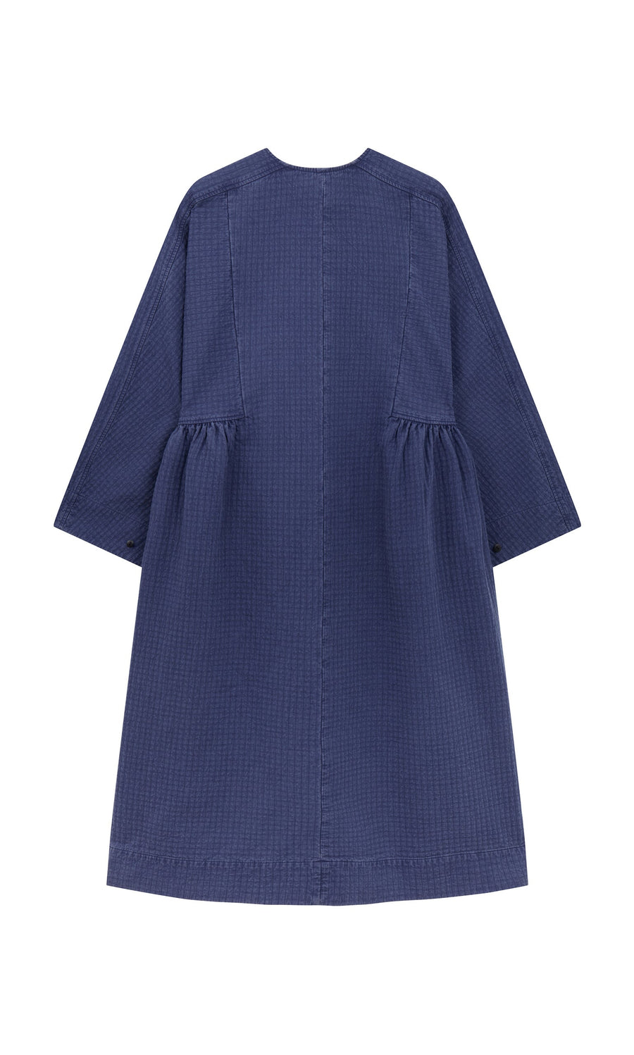 Plümo- Back view of the Matilda Dress featuring a full skirt, long sleeves, and gathered sides, made in London.