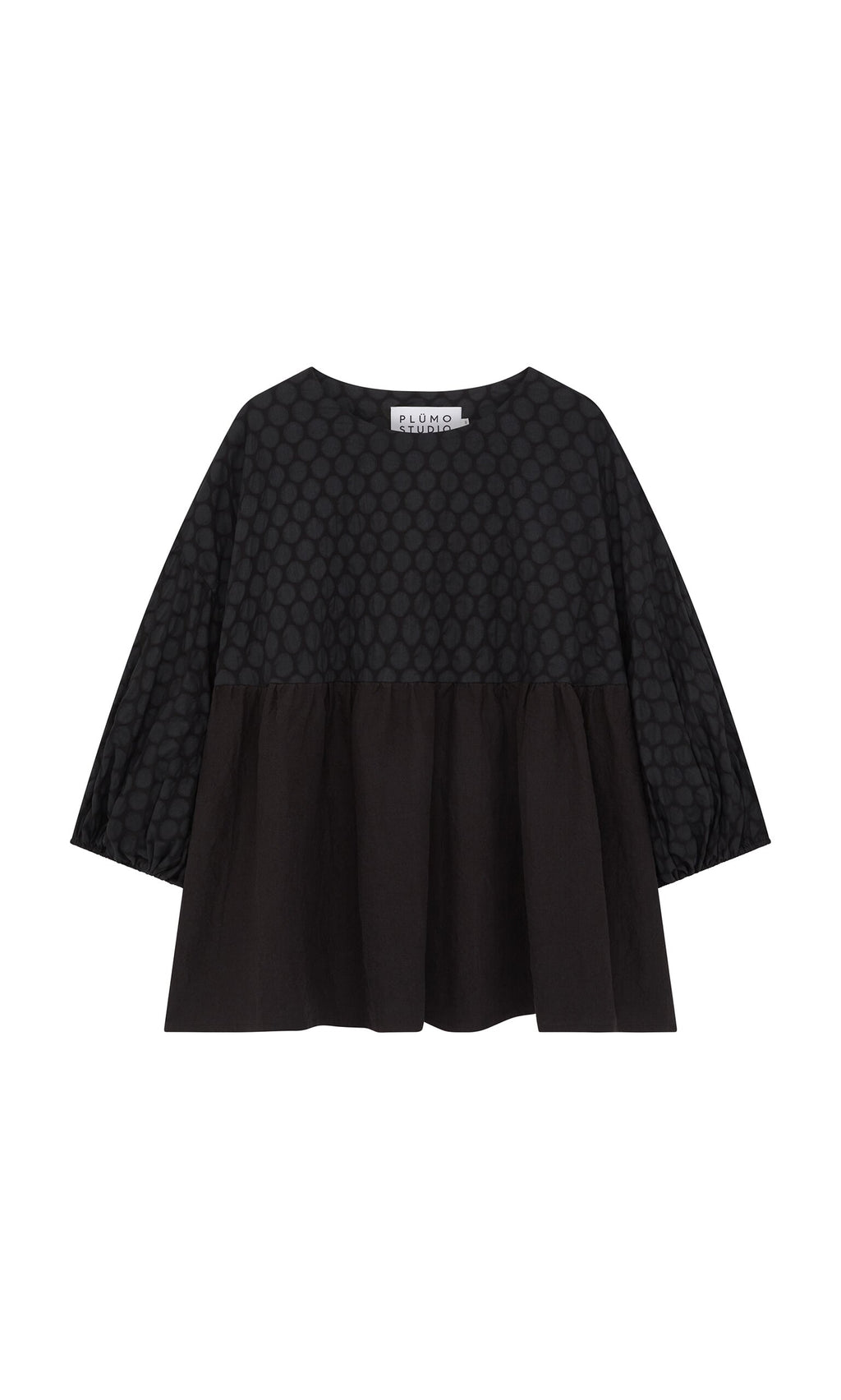 Plümo- The Tuppence Blouse is a loose black top with a textured dot pattern and wide three-quarter sleeves.