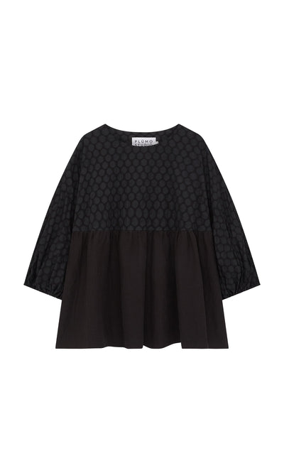Plümo- The Tuppence Blouse is a loose black top with a textured dot pattern and wide three-quarter sleeves.