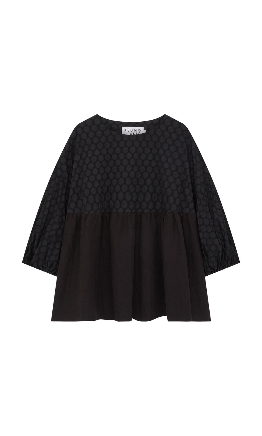 Plümo- The Tuppence Blouse is a loose black top with a textured dot pattern and wide three-quarter sleeves.
