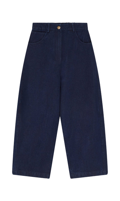 Plümo- Barrel Pants Indigo: High-waisted, wide-leg dark denim jeans with front pockets and button closure, made in England.