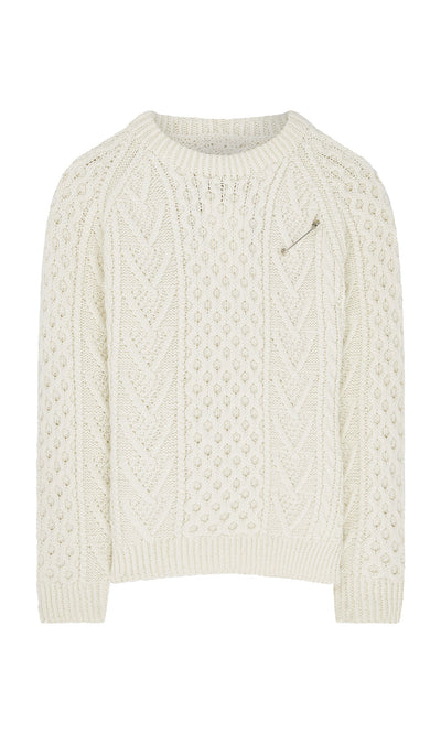 Plümo- The Berg Aran Sweater is cream-colored with a Celtic cable knit and a small zippered chest pocket.
