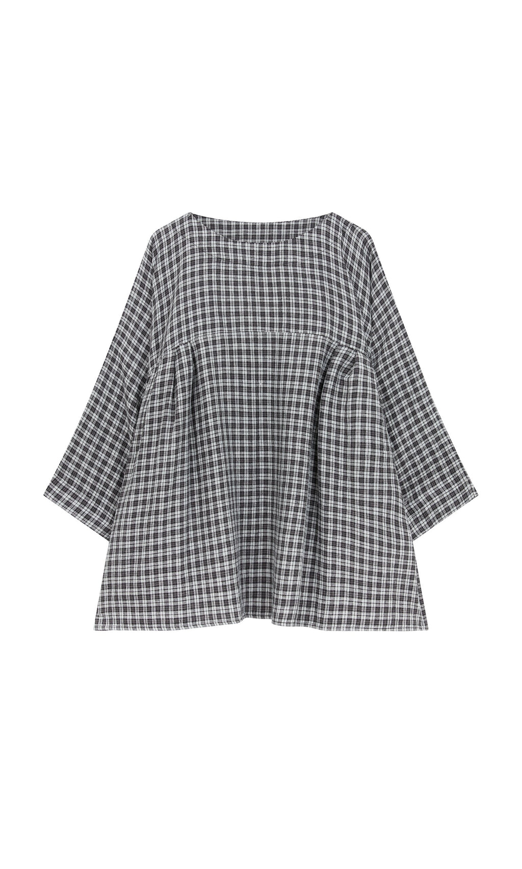 Plümo- The Kelli Blouse - Plaid features a loose fit, long sleeves, wide neckline, and ruffled hem in black and white plaid.