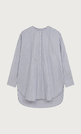 Plümo  Blue and white vertical striped button-up shirt with long sleeves and a curved hem, laid flat on a white background.