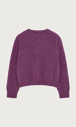 Plümo  A purple long-sleeve knit sweater with a crew neckline and ribbed cuffs and hem, laid flat on a white background.