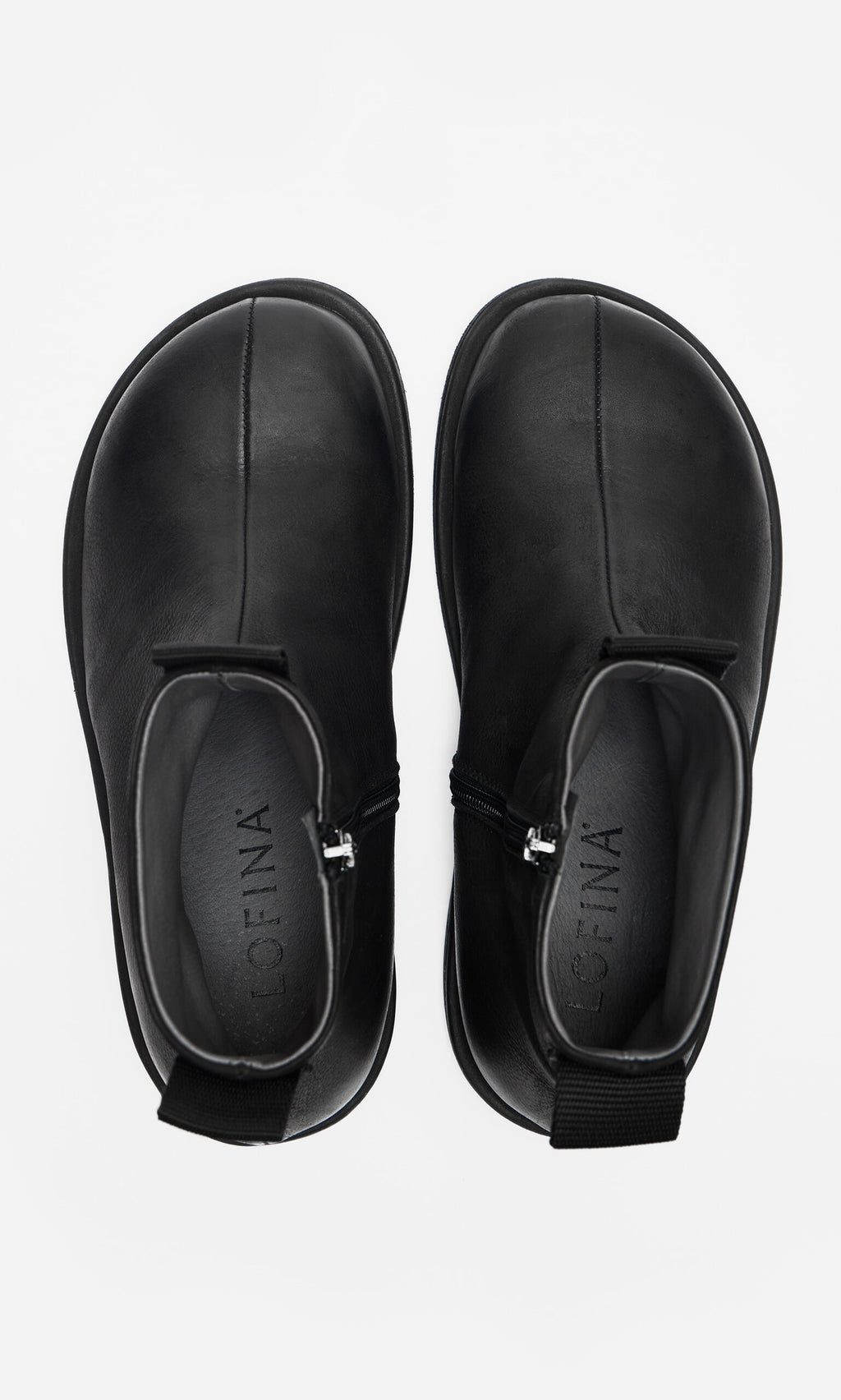 Plümo- Ancona Boots: waxy leather ankle boots with side zippers and pull tabs, shown from above on white.