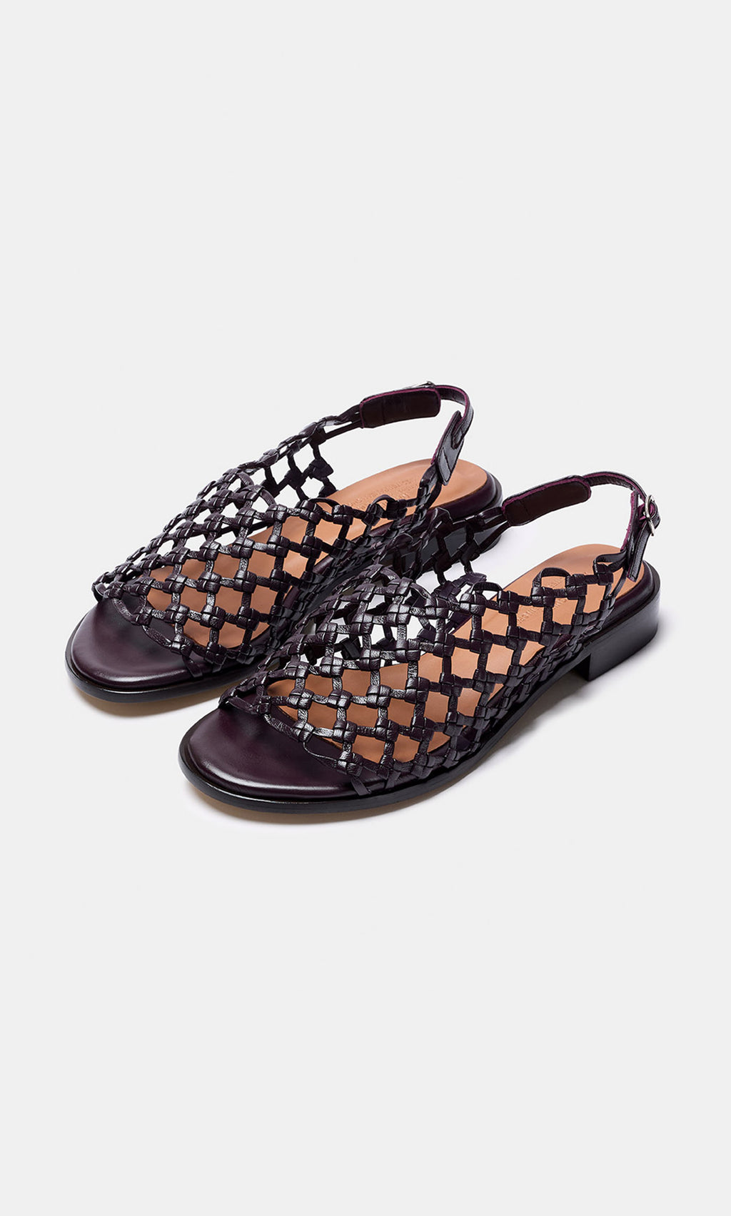 Plümo- Arts Club Sandals: Black woven leather sling-back sandals, low heel, handcrafted in Spain, shown on white background.