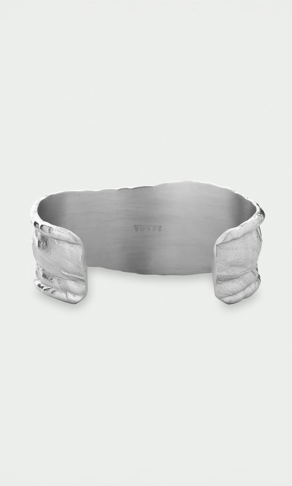 Plümo- The Bastion Bangle features an organic, textured edge and smooth interior, crafted from recycled silver jewelry.
