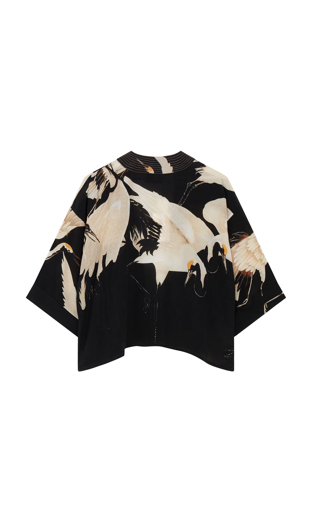 Plümo- The Black Stork Kimono is a relaxed-fit, short-sleeve top with wide sleeves and a white stork in flight print.