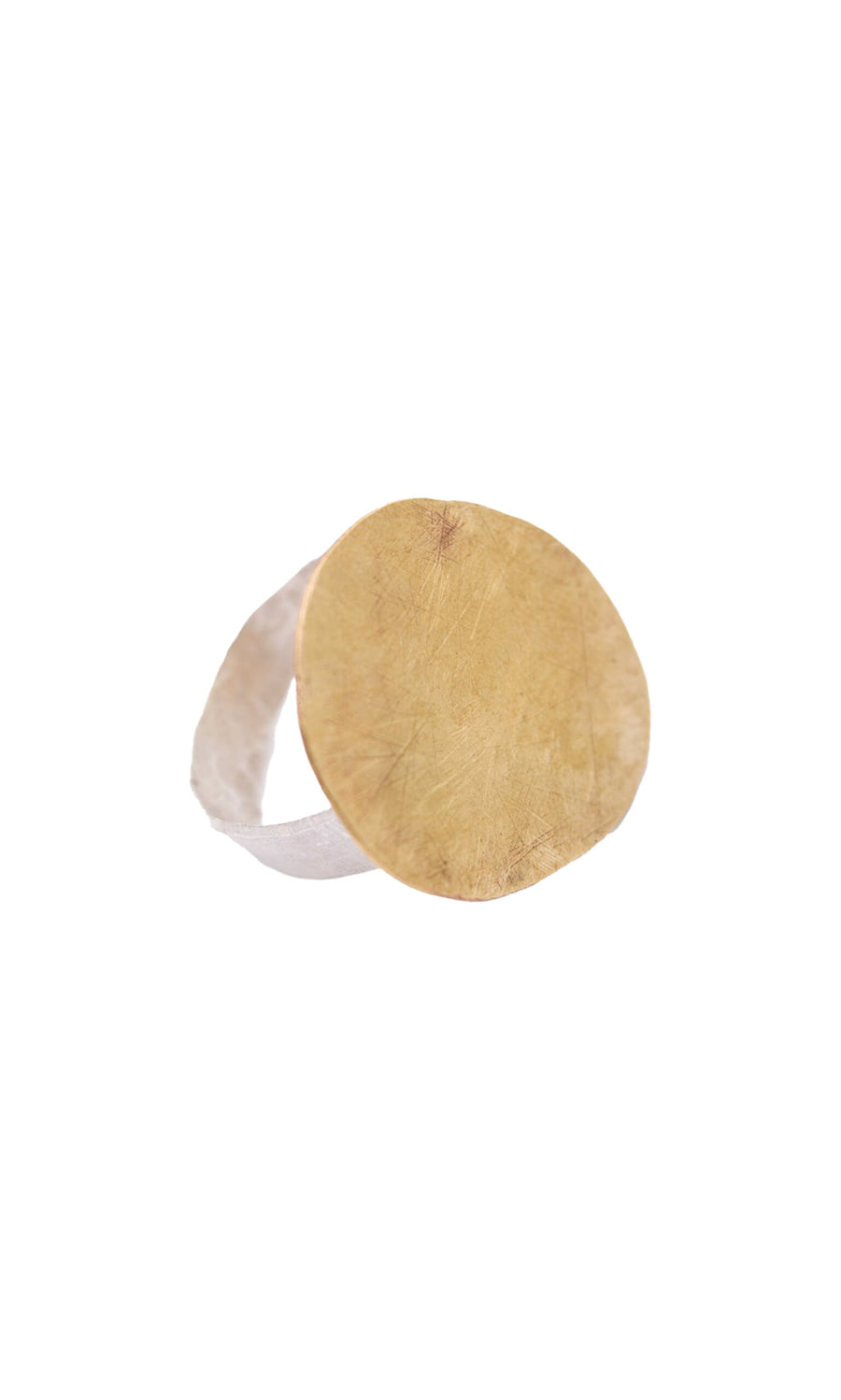 Plümo- Brass Pebble Ring: A pebble-shaped wide gold disc sits on a textured eco-silver band, shown on a white background.