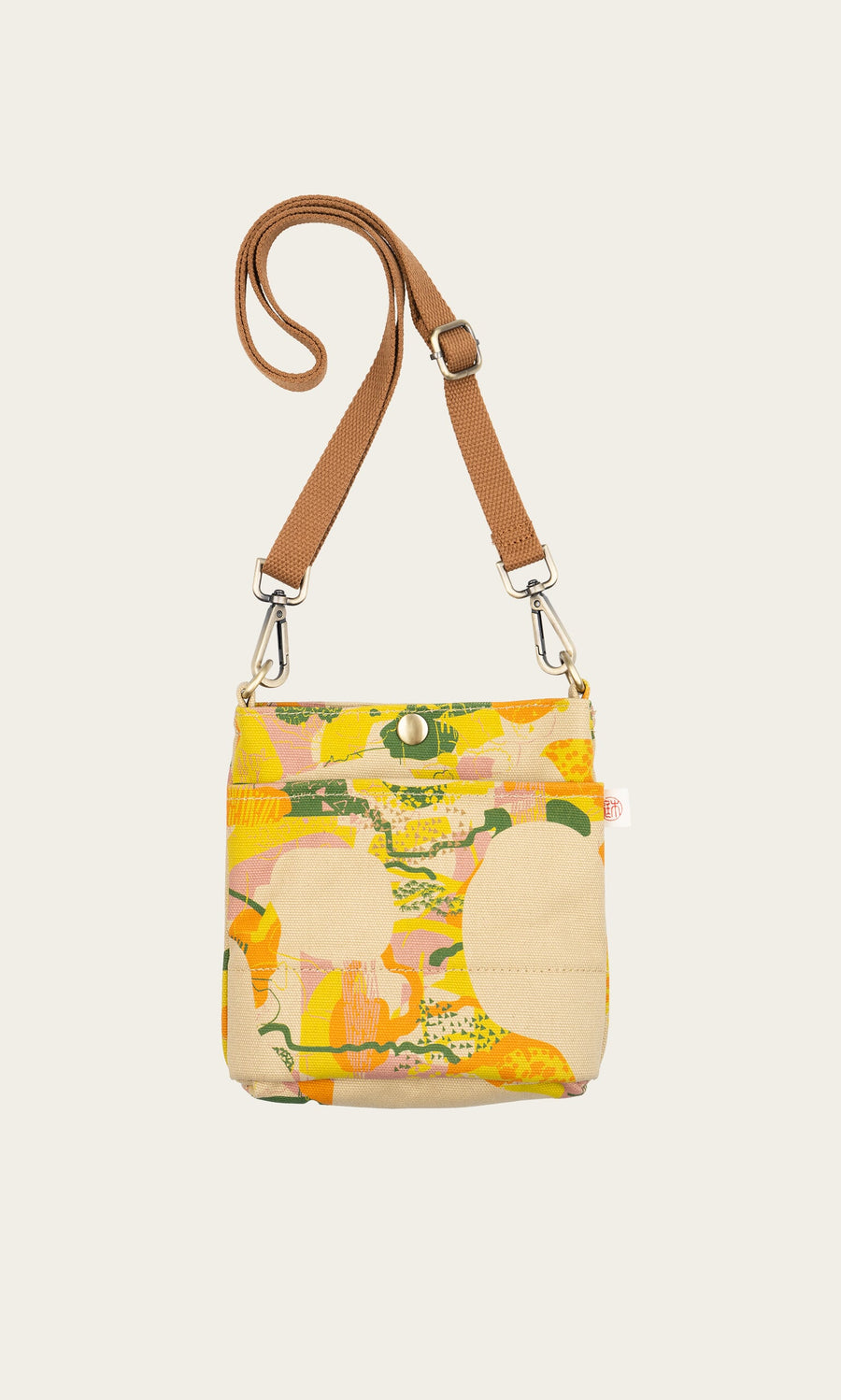 Plümo- Camo Pouch Bag: Weatherproof canvas shoulder bag with brown strap and yellow, orange, beige abstract pattern.