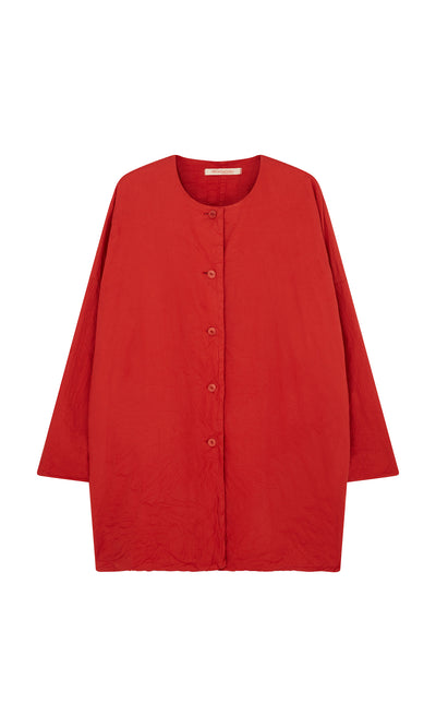 Plümo  Relaxed, long-sleeve Coburn Jacket in hand-dyed red cotton with no collar, button-up front. Shown on white background.