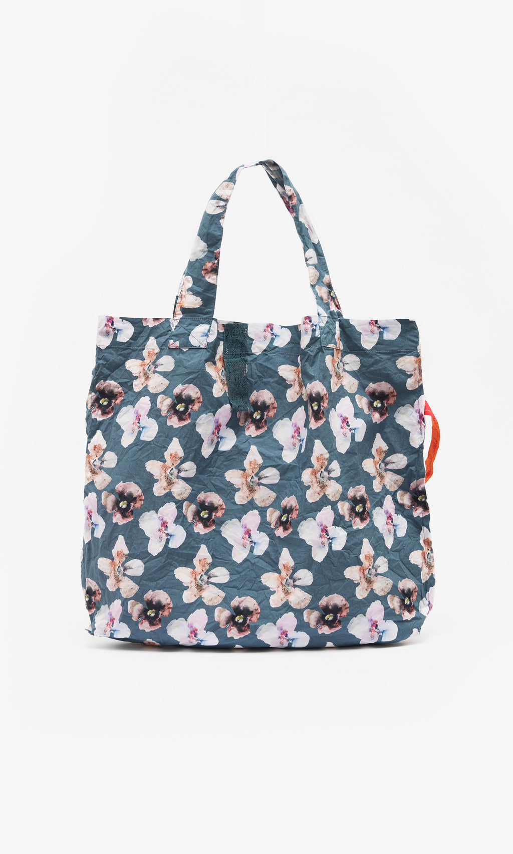 Plümo  Dahlia Tote: Lightweight cotton bag with blue floral print, two handles, and a right-side orange accent.