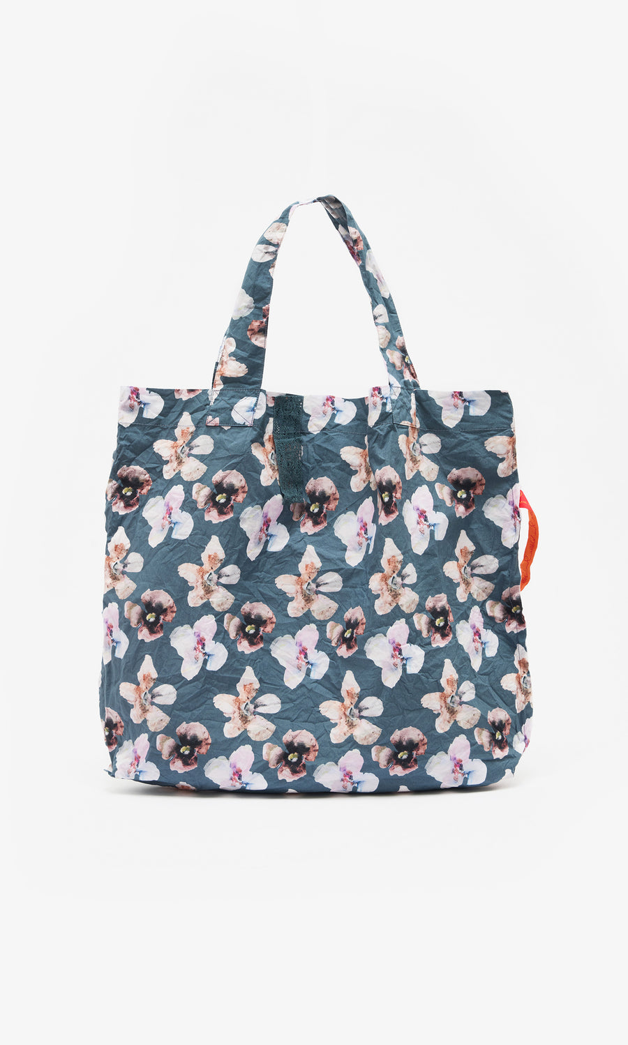 Plümo  Dahlia Tote: Lightweight cotton bag with blue floral print, two handles, and a right-side orange accent.