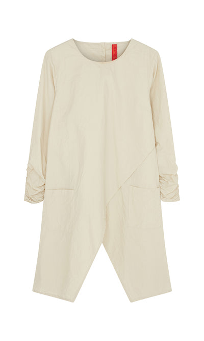 Plümo  Clementine Blouse: Cream, long-sleeved Swedish tunic with asymmetrical hem, ruched sleeves, and front pockets.