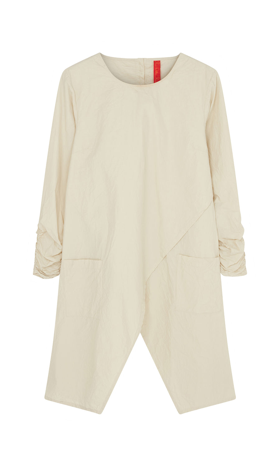 Plümo  Clementine Blouse: Cream, long-sleeved Swedish tunic with asymmetrical hem, ruched sleeves, and front pockets.