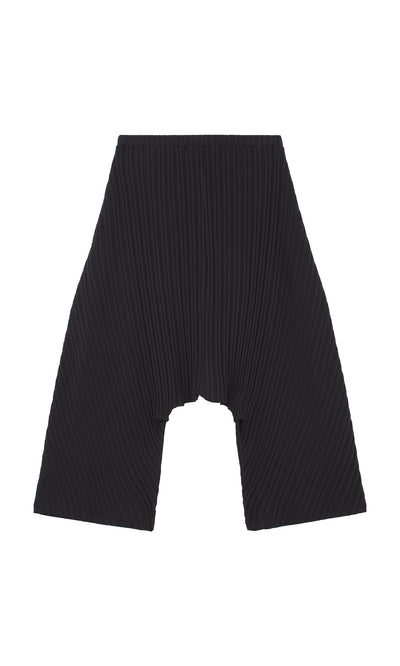 Plümo  Acker Pants—black pleated wide-leg shorts with elastic waistband, Danish-inspired, shown flat on white background.
