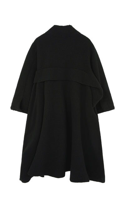 Plümo  Brabant Coat: a loose-fitting black boucle wool coat with wide sleeves and draped back on white background.