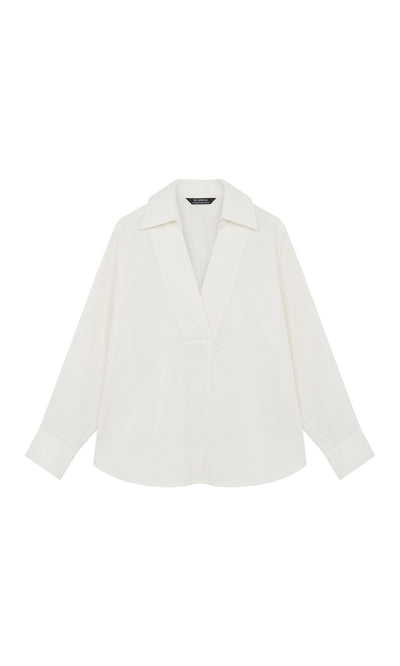 Plümo  Kaburi Shirt: White textured long-sleeve blouse with wide cutaway collar, V-neck, and Yacco Maricard-inspired design.