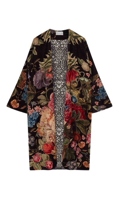 Plümo  The Shilling Velvet Coat is a long black kimono jacket with a vibrant floral pattern and printed inner lining.