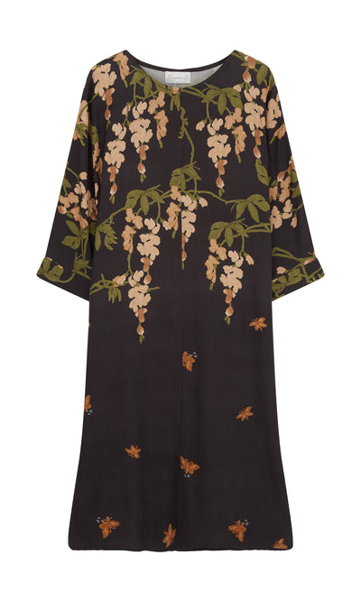 Plümo  Whisteria Dress: Black organic midi with elbow sleeves, beige floral print, and green leafy accents.