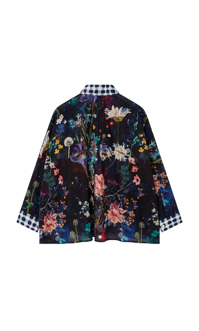 Plümo  The Foye Flower Shirt: dark floral jacket with wide sleeves and a black-and-white gingham collar and cuffs.
