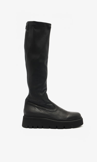 Plümo  Long Prato Boots—sustainable black knee-length pair with chunky ridged soles, pictured in profile on white.