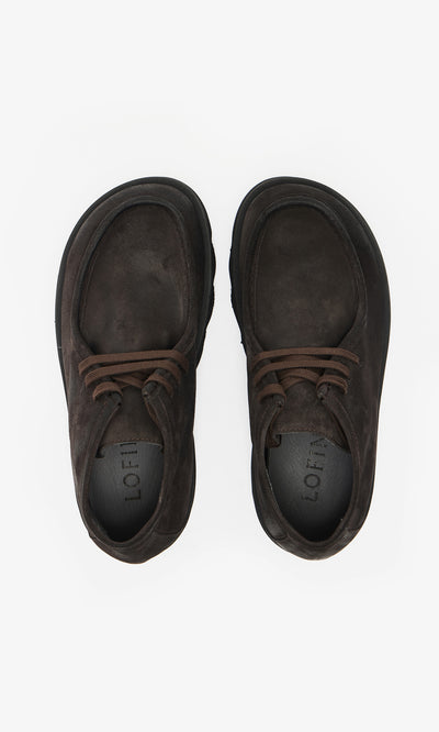 Plümo  A pair of handcrafted Rolla Boots in Italian dark brown suede, lace-up style with rounded toes, shown from above.