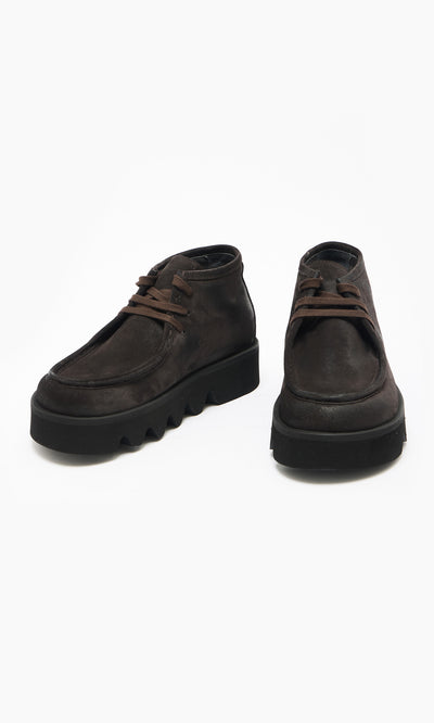 Plümo  Rolla Boots: Handcrafted Italian mocha suede moccasins with chunky black platform soles on white background.