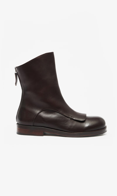 Plümo  Crafted in Italy, Over Boots are dark brown leather ankle boots with a military gaiter style and a low wooden heel.