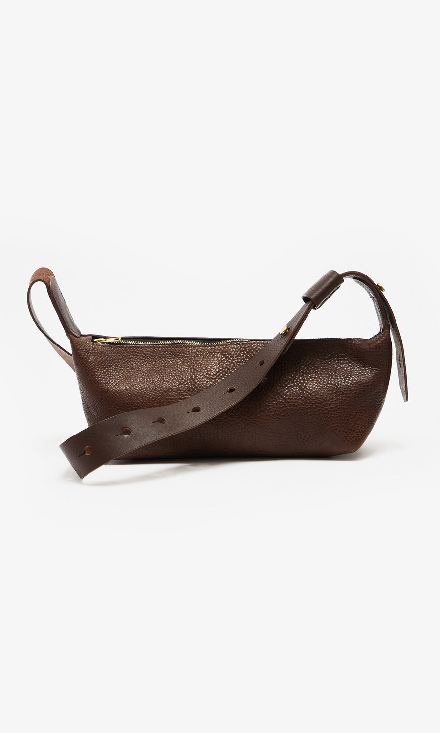 Plümo  Hattie Bag: Dark brown Italian leather crossbody with wide strap and gold zipper, shown on white background.