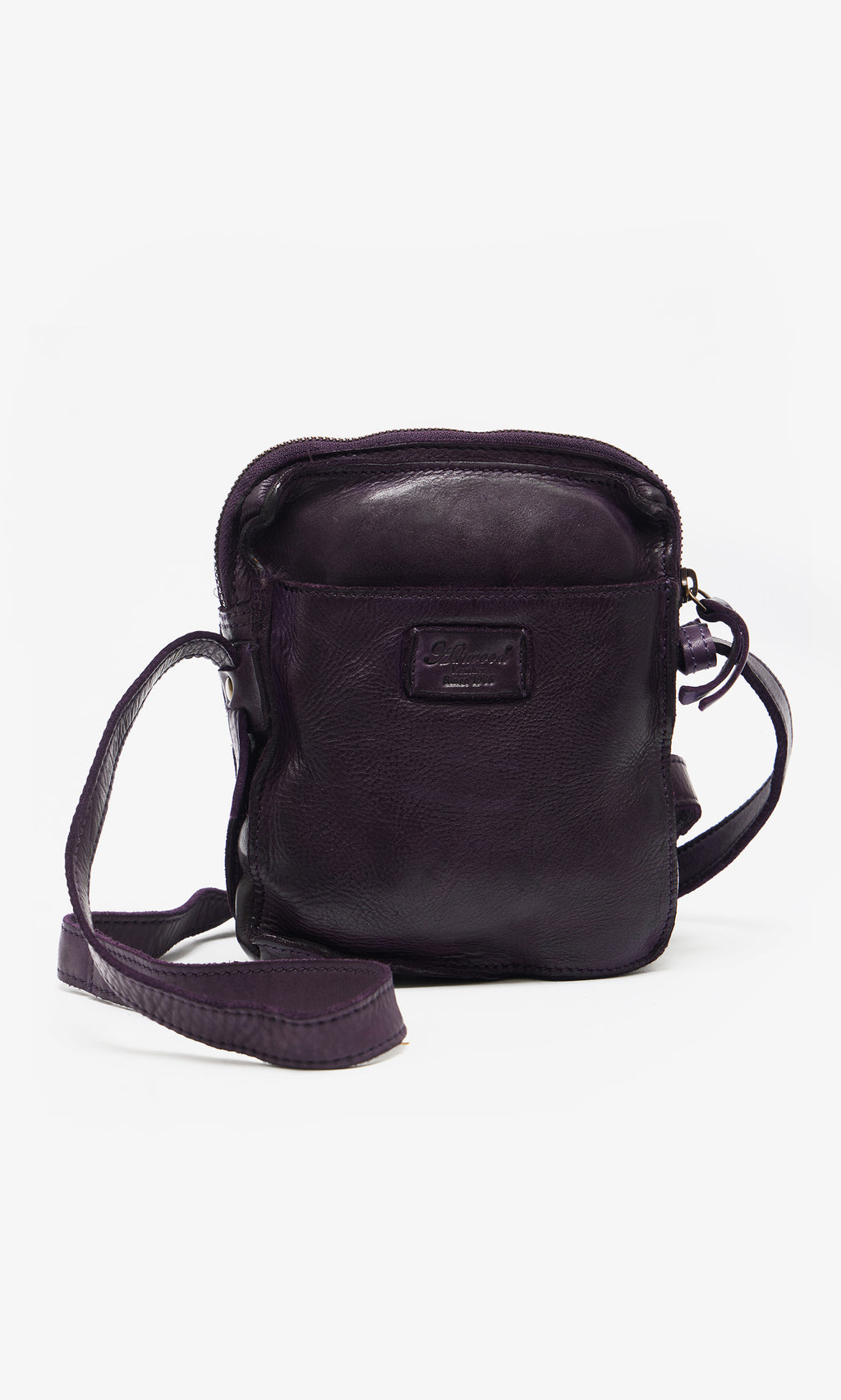 Plümo  Loyd Bag: Small dark purple leather pouch with zipper, long strap, and front logo patch on white background.