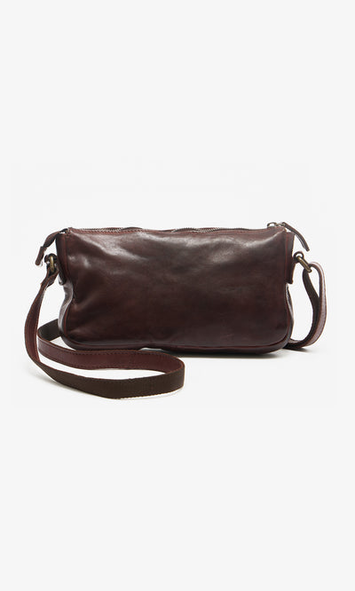 Plümo  The Luxton Bag is a chestnut satchel in dark brown leather with a long strap, featuring classic British design.