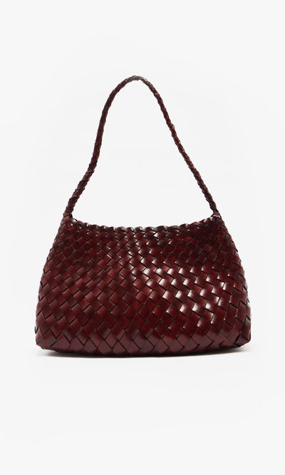 Plümo  Moone Bag: dark red hand-woven leather shoulder bag from South Africa, shown on a plain white background.
