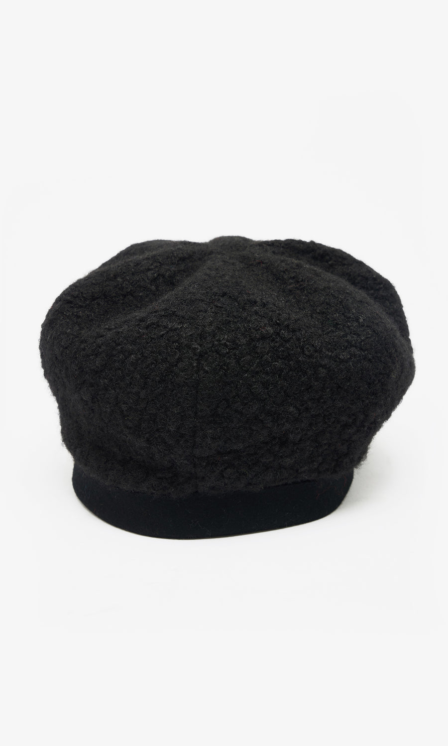 Plümo  The Perinne Beret: black boucle with a soft, rounded crown and flat brim, shown on white for adjustable fit.