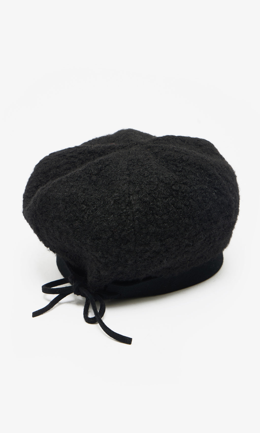 Plümo  The Perinne Beret: a handmade black Parisian boucle beret with a small back bow, shown on a white background.